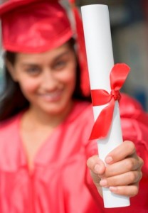 grant vs scholarship, graduate holding her diploma